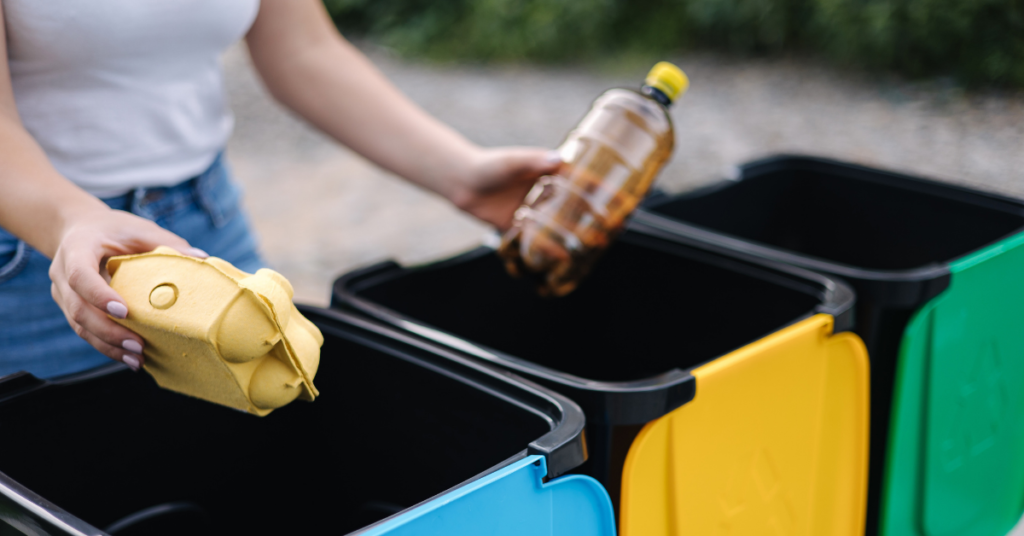 woman sorting waste in bins
